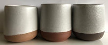 Load image into Gallery viewer, Example of pinholes on three cone 6 clay bodies